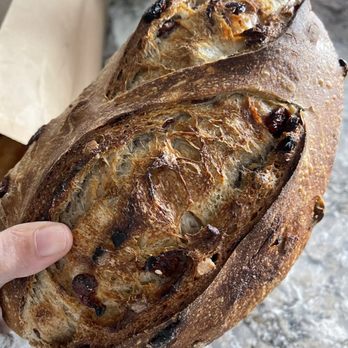 Barrio Bread signature dishes  Heritage Grain Loaves (e.g., Barrio Baguette, Einkorn, Sonoran White Wheat), Pan Rustico, various seasonal specialty breads.